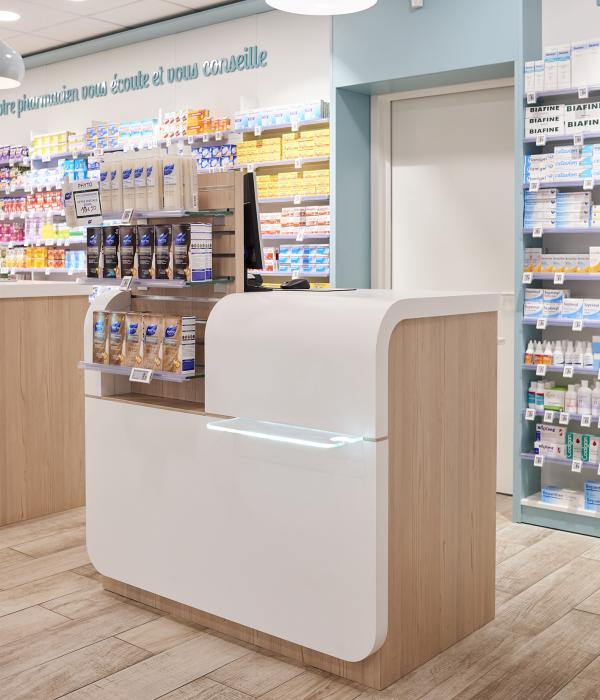 agencement pharmacie comptoir arrondis blanc bois